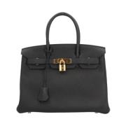 Pre-owned Leather handbags Hermès Vintage , Black , Dames