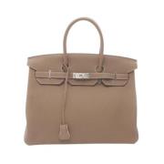 Pre-owned Leather handbags Hermès Vintage , Beige , Dames