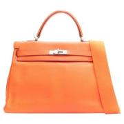 Pre-owned Leather handbags Hermès Vintage , Orange , Dames