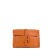 Pre-owned Leather clutches Hermès Vintage , Brown , Dames