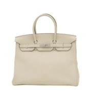 Pre-owned Leather handbags Hermès Vintage , Beige , Dames