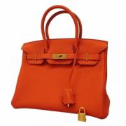 Pre-owned Leather handbags Hermès Vintage , Orange , Dames