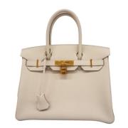 Pre-owned Leather handbags Hermès Vintage , Beige , Dames