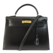 Pre-owned Leather handbags Hermès Vintage , Black , Dames