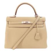 Pre-owned Leather handbags Hermès Vintage , Beige , Dames