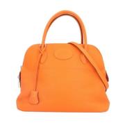 Pre-owned Leather handbags Hermès Vintage , Orange , Dames