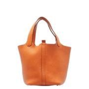 Pre-owned Leather handbags Hermès Vintage , Orange , Dames