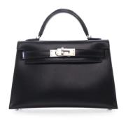 Pre-owned Leather handbags Hermès Vintage , Black , Dames