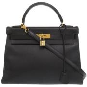 Pre-owned Leather handbags Hermès Vintage , Black , Dames