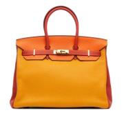 Pre-owned Leather handbags Hermès Vintage , Orange , Dames