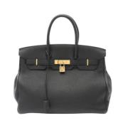 Pre-owned Leather handbags Hermès Vintage , Black , Dames