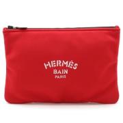 Pre-owned Canvas clutches Hermès Vintage , Red , Dames