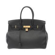 Pre-owned Leather handbags Hermès Vintage , Black , Dames