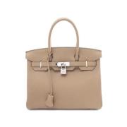 Pre-owned Leather handbags Hermès Vintage , Beige , Dames