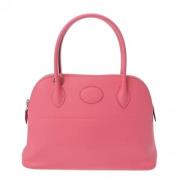 Pre-owned Leather handbags Hermès Vintage , Pink , Dames