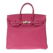 Pre-owned Leather handbags Hermès Vintage , Pink , Dames