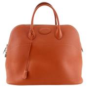 Pre-owned Leather handbags Hermès Vintage , Orange , Dames