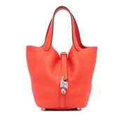 Pre-owned Leather handbags Hermès Vintage , Orange , Dames