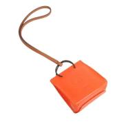 Pre-owned Leather key-holders Hermès Vintage , Orange , Unisex