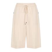 Poederkleurige comfort fit Bermuda shorts van vloeiende Tencel-stof Ic...