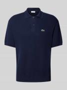 Relaxed fit poloshirt met logobadge