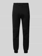 Tapered fit sweatpants met labelprint