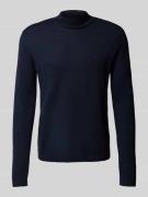 Gebreide pullover van merinowol met opstaande kraag, model 'Tern'