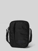 Schoudertas van waterafstotend materiaal