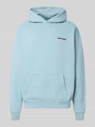 Oversized hoodie met logo en kangoeroezak
